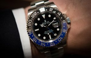 The 40 mm fake Rolex GMT-Master II 116710BLNR watches have black dials.